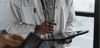 Doctor reviewing patient data on a tablet